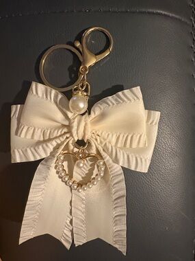 Cream Bow Key & Card Holder Charm with Pearl Heart Accent. NWOT